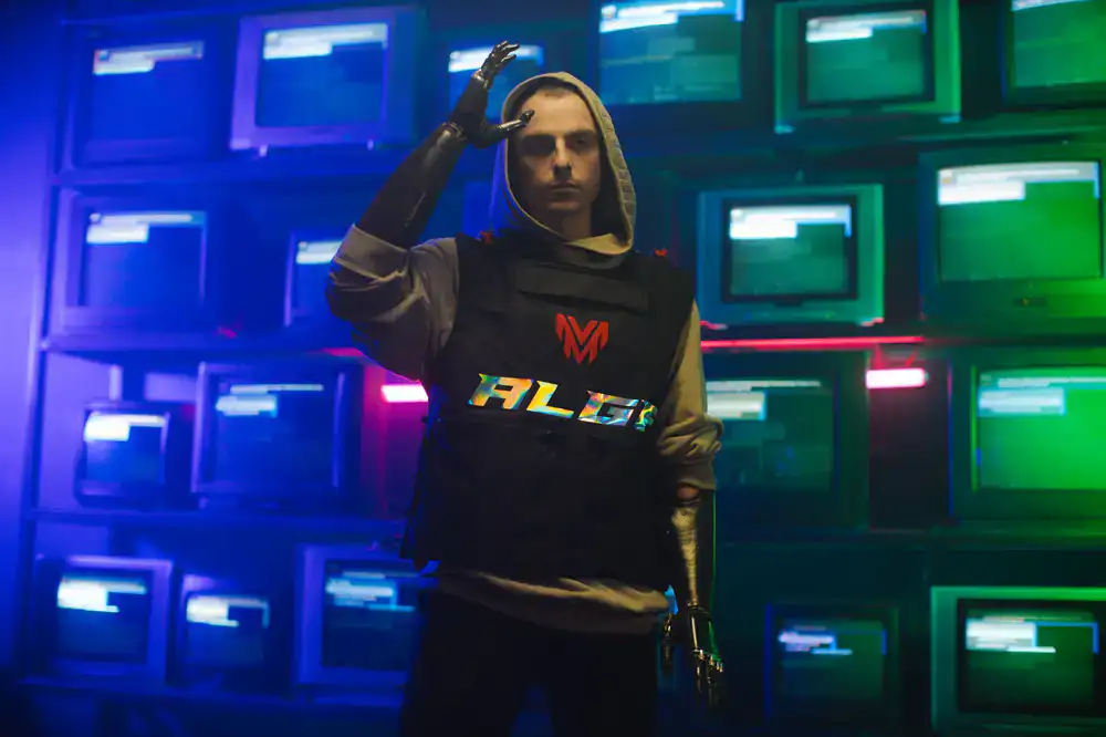 Model wearing black hoodie with glitch graphics