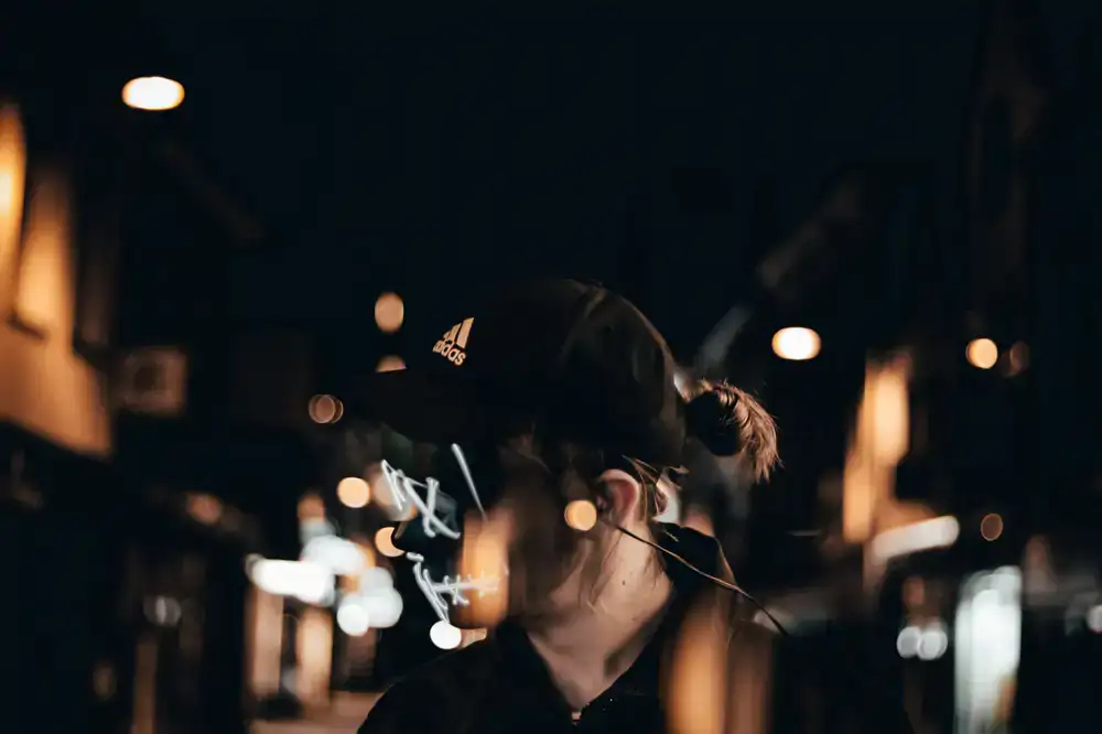 Model wearing Loot Threads in an urban nighttime setting